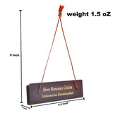 Brown wooden plaque with gold script on Hanuman Chalisa book cover