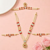 Gold-toned Hindu God Goddess shringaar jewelry set with intricate red and white pearl strands and sparkling gemstone accents
