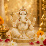 Cream-colored ganesha statue with gold accents and red gemstones from hindu god goddess shringaar jewellery set