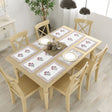 Six floral rose cotton placemats in pink gray on table