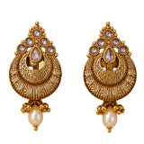 Indian kundan and faux pearls gold tone chandbali earrings with intricate filigree and teardrop stones for ethnic wear
