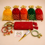 A set of five vibrant velvet potli bags in yellow red orange and green with gold lattice pattern and tassel drawstrings
