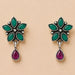 Silver oxidized floral earrings with six emerald green leaf stones and a dangling ruby teardrop for ethnic wear