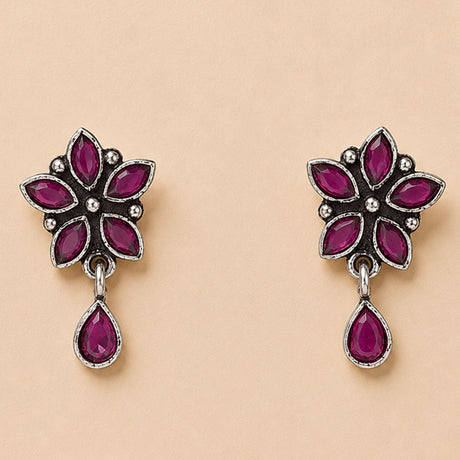 Indian oxidized silver floral earrings with vibrant fuchsia gemstones and teardrop pendant for traditional ethnic wear