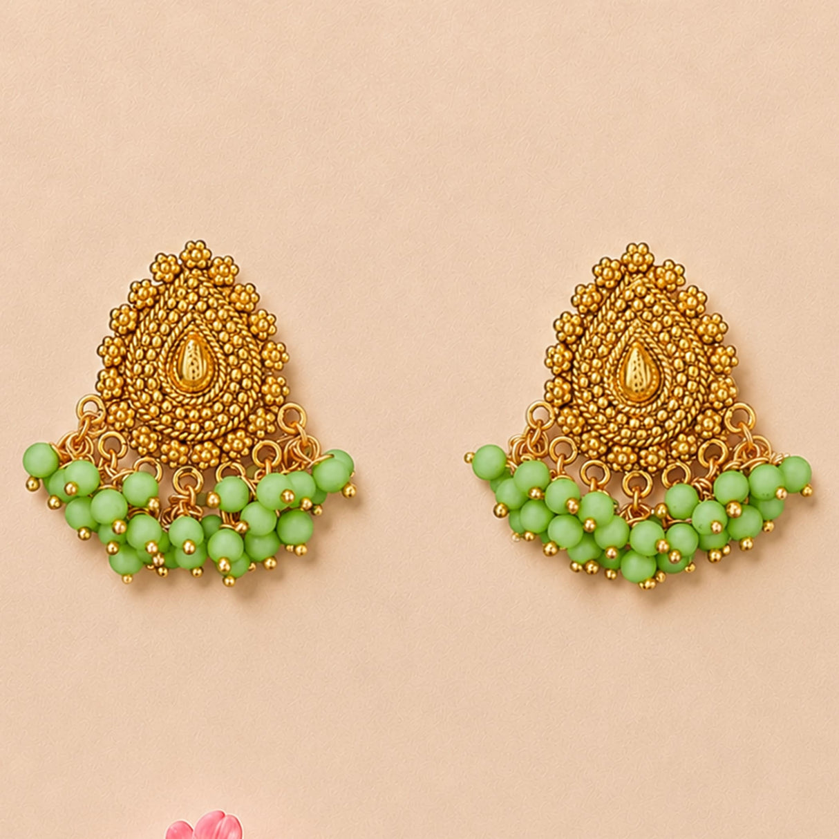 Indian chandbali gold tone dangle earrings with intricate bead detailing and mint green beads for wedding and ethnic wear
