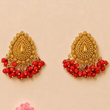 Indian chandbali gold tone dangle earrings with intricate beads and red bead drops for wedding and ethnic wear