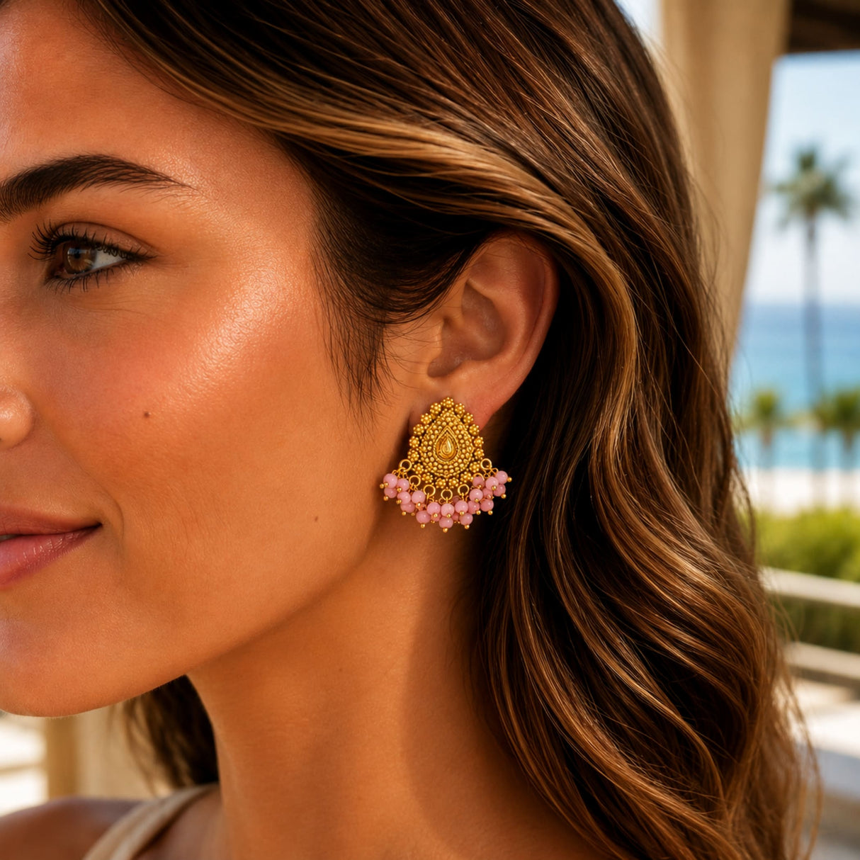 Indian chandbali gold tone drop earring with intricate filigree and cascading pink beads for wedding and ethnic wear
