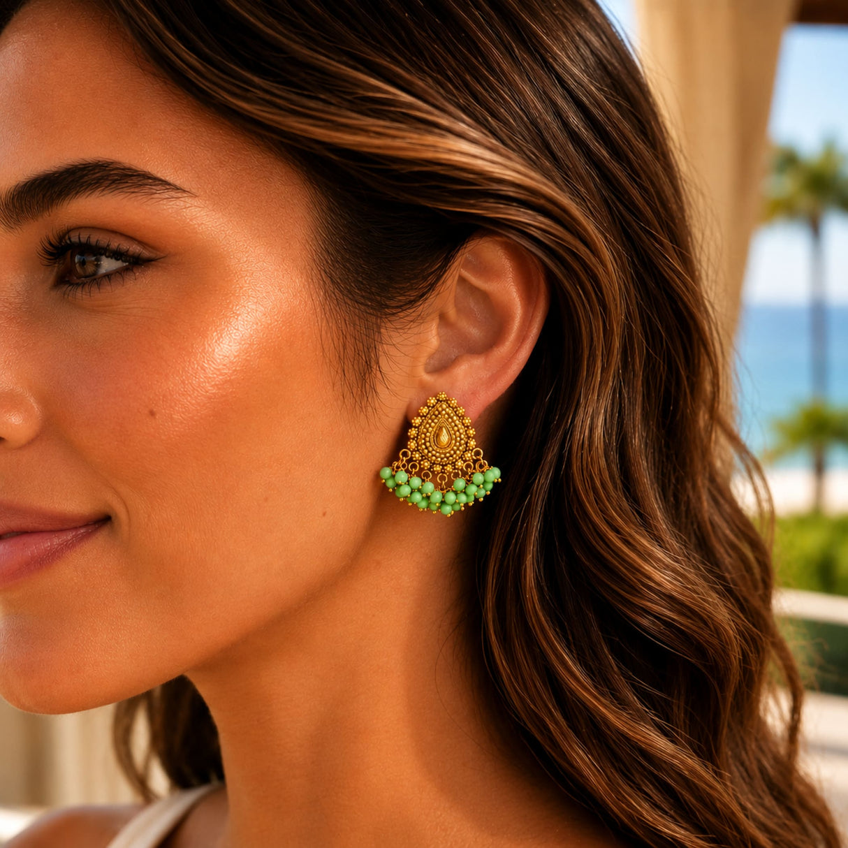 Indian chandbali gold tone dangle earrings with intricate filigree and mint green bead fringe for wedding and ethnic wear