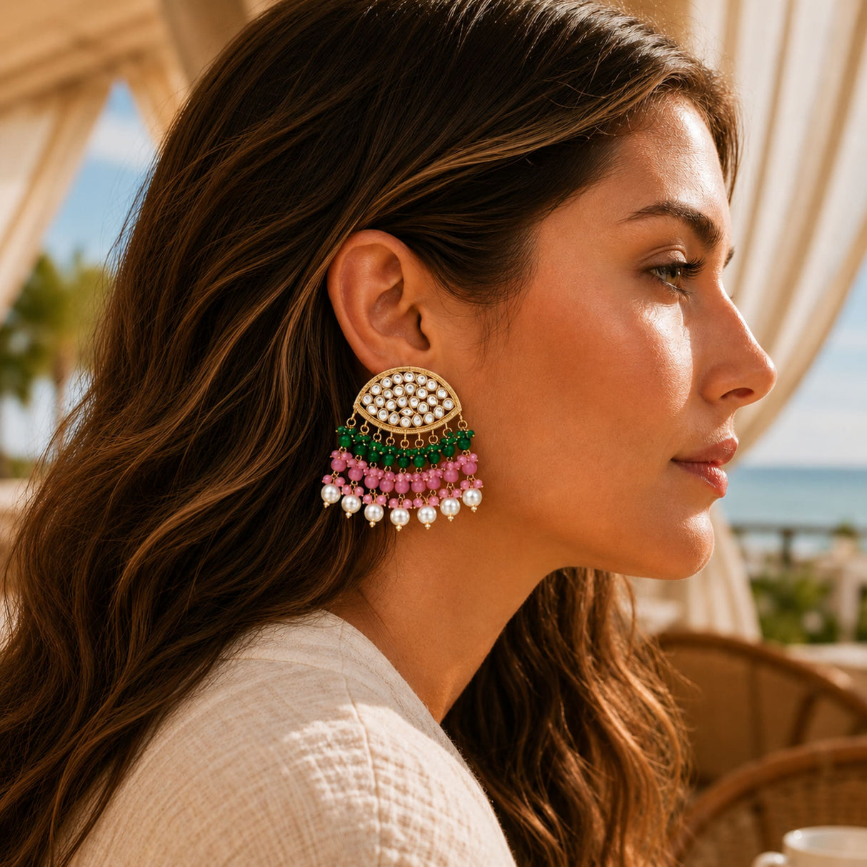 Indian kundan stone and faux pearl multi-tiered gold tone chandelier earrings with white pearls and green and pink beads