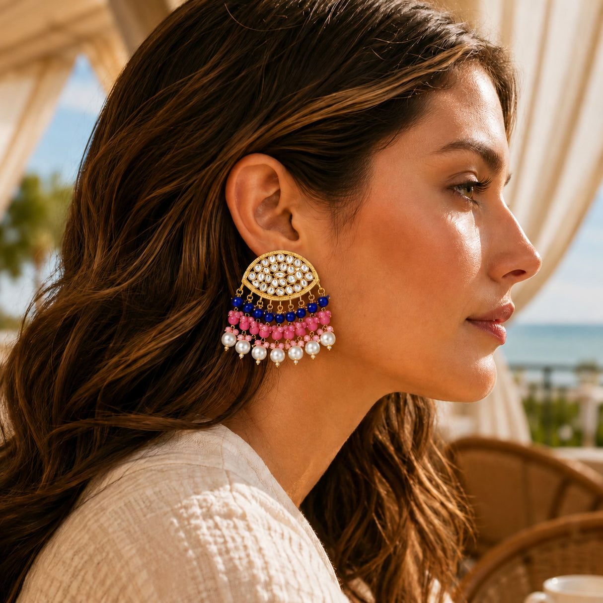 Gold tone chandbali earrings with kundan stones, white pearls, pink and blue beads, perfect for Diwali and weddings