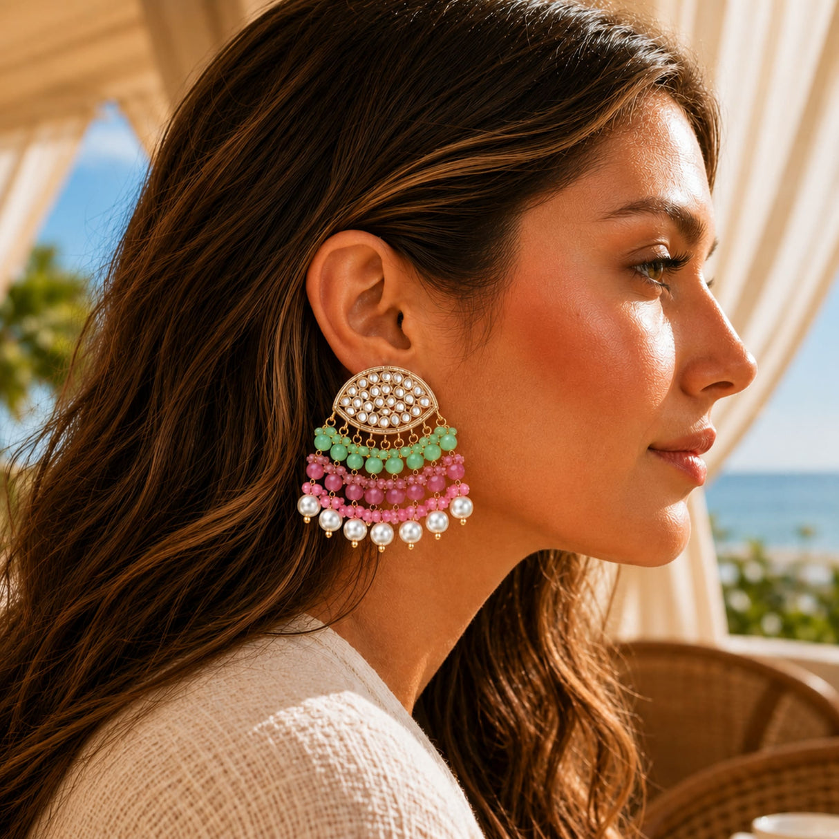 Pastel-colored multi-tiered indian kundan stone and faux pearl chandelier earrings with gold tone frame and mint green beads