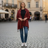 A rich burgundy Indian pashmina shawl made of soft wool with delicate fringe detailing, ideal for Christmas and wedding gifts