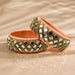 Peach satin Indian silk thread bangles with gold-trimmed mirrored squares for traditional bridal and gift use