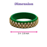 Green silk thread bangle adorned with gold-toned diamond-shaped embellishments for Indian bridal or gift use