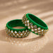 Vibrant green indian silk thread bangles for women adorned with square-cut crystals in gold-toned metal frames