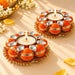 Two pack decorative orange and gold metal tea light candle holders with clear crystal accents for festive home decor