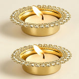 Gold-colored tea light candle holders with clear rhinestone rim designed for indian decorative and festive home decor use