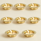 Gold-colored metal tea light candle holders with decorative beaded rim for home temple and festive decor centerpiece