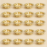Gold-colored tea light holders with sparkling gemstone-encrusted rims for indian decorative centerpiece and festive decor