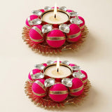 Vibrant pink indian decorative tea light candle holder with gold trim and crystal accents for home and festive decor
