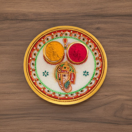 Ceramic Ganesh puja thali with vibrant colors and intricate designs for Indian Pooja decor