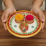 White marble Pooja Thali with colorful Hindu deity design and gold rim for Hindu worship