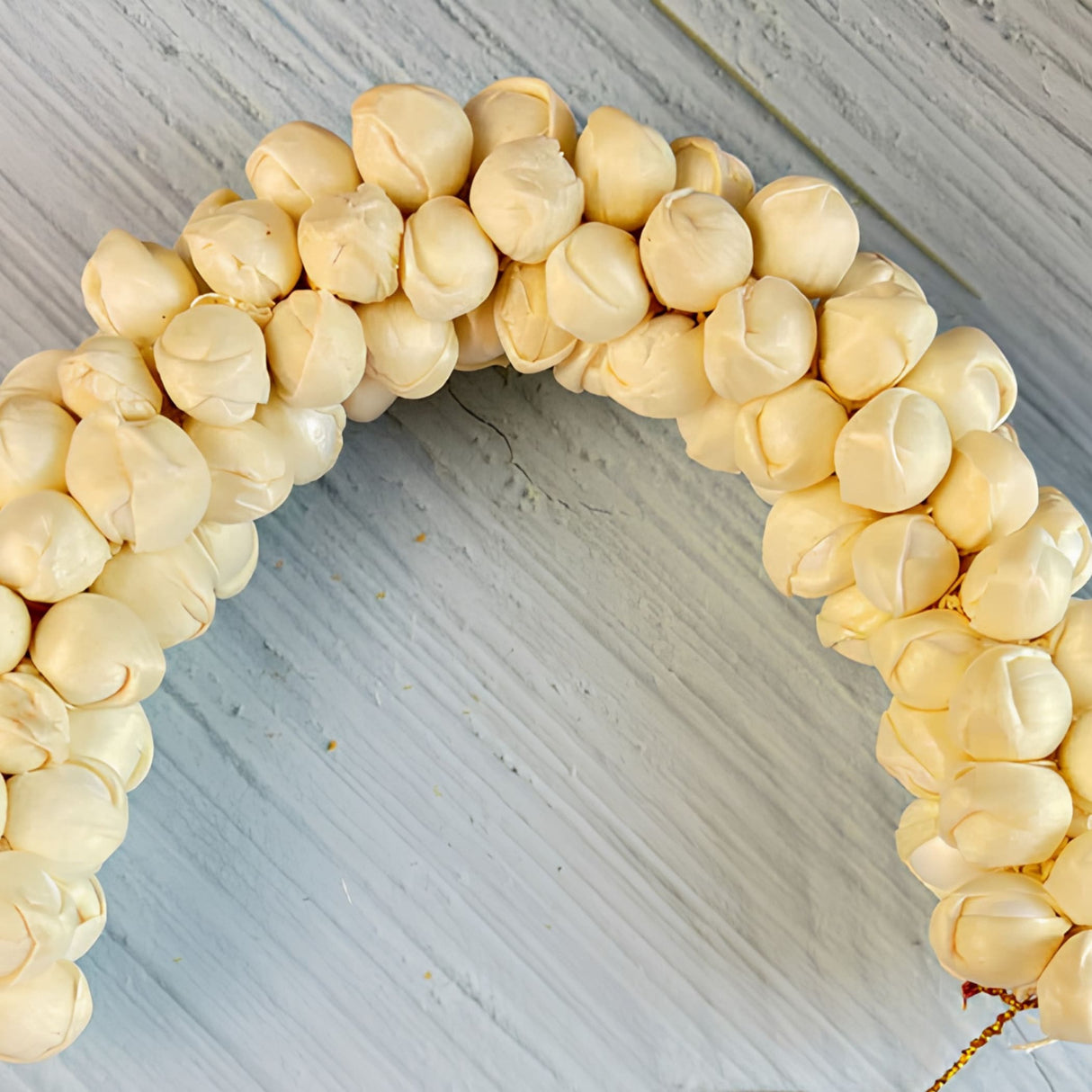 Cream-colored round wooden bead wreath, traditional artificial jasmine gajra for bridal mehndi and wedding hair accessory