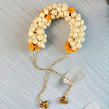 Traditional artificial jasmine gajra in cream and yellow with gold tassels and bells for bridal mehndi and weddings