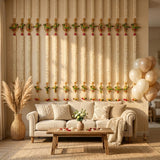 Beige upholstered sofa with textured knit pillows and soft throw blanket beside jasmines parrot strings artificial floral garland for indian wedding decor