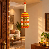 A vibrant orange yellow and white jumbo artificial marigold jhoomer chandelier garland hanging from ceiling for decor