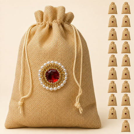 Beige jute potli bag with red gemstone embellishment and gold beads for eid gifts and wedding favors