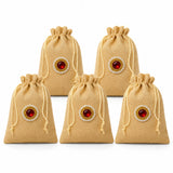 Beige jute potli bags with red gemstone and pearl embellishments ideal for eid gifts and indian wedding favors