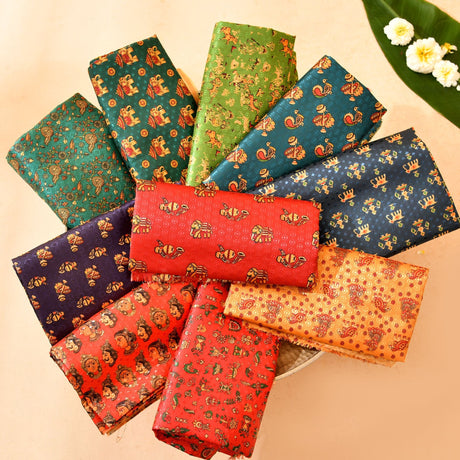 A collection of unstitched kalamkari multicolor silk blouse pieces with vibrant teal green red and gold hues for indian gifts
