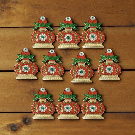 Red and gold ceramic Christmas ornament set with floral patterns for Diwali and Pooja decor