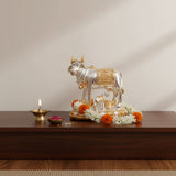 Silver gold-plated Kamdhenu cow calf idol with saddle garlands