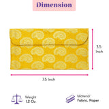 A vibrant yellow fabric envelope clutch with textured circular motifs for Navratri Kanya Pujan and festive gift hampers
