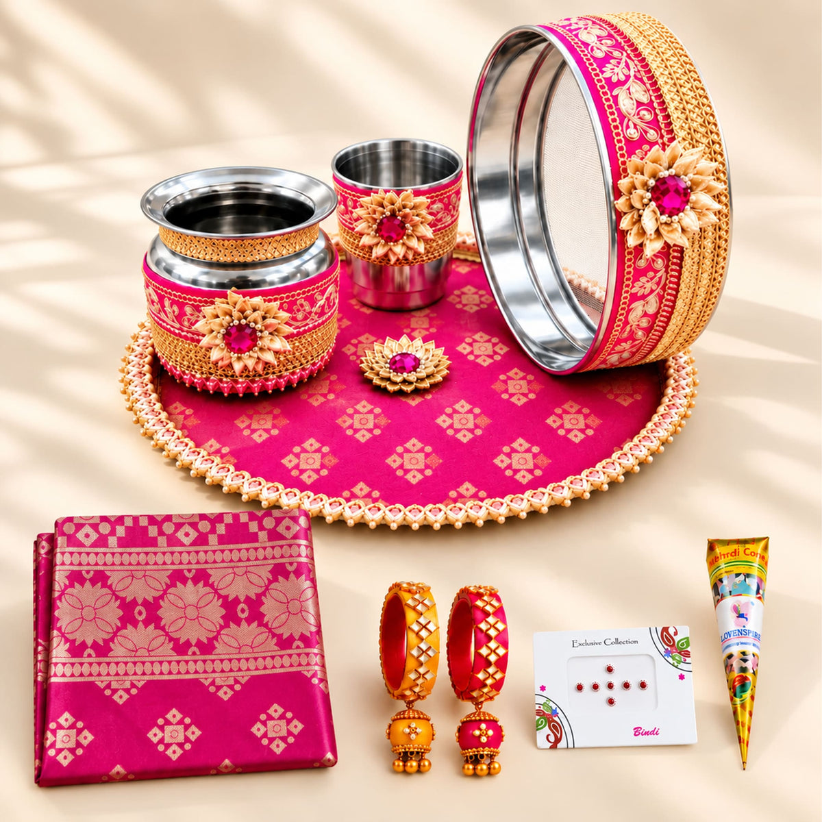 Pink and gold karwa chauth pooja thali set with intricate floral patterns and beaded edges for festive gifting