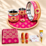 Pink and gold karwa chauth pooja thali set with intricate floral patterns and beaded edges for festive gifting