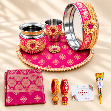 Pink and gold karwa chauth pooja thali set with intricate floral patterns and beaded edges for festive gifting