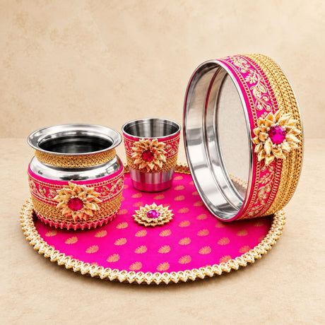Karwa chauth pooja thali set for women with vibrant pink and gold ornate metal accents ideal for traditional gifting