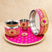 Karwa chauth pooja thali set for women with vibrant pink and gold ornate metal accents ideal for traditional gifting