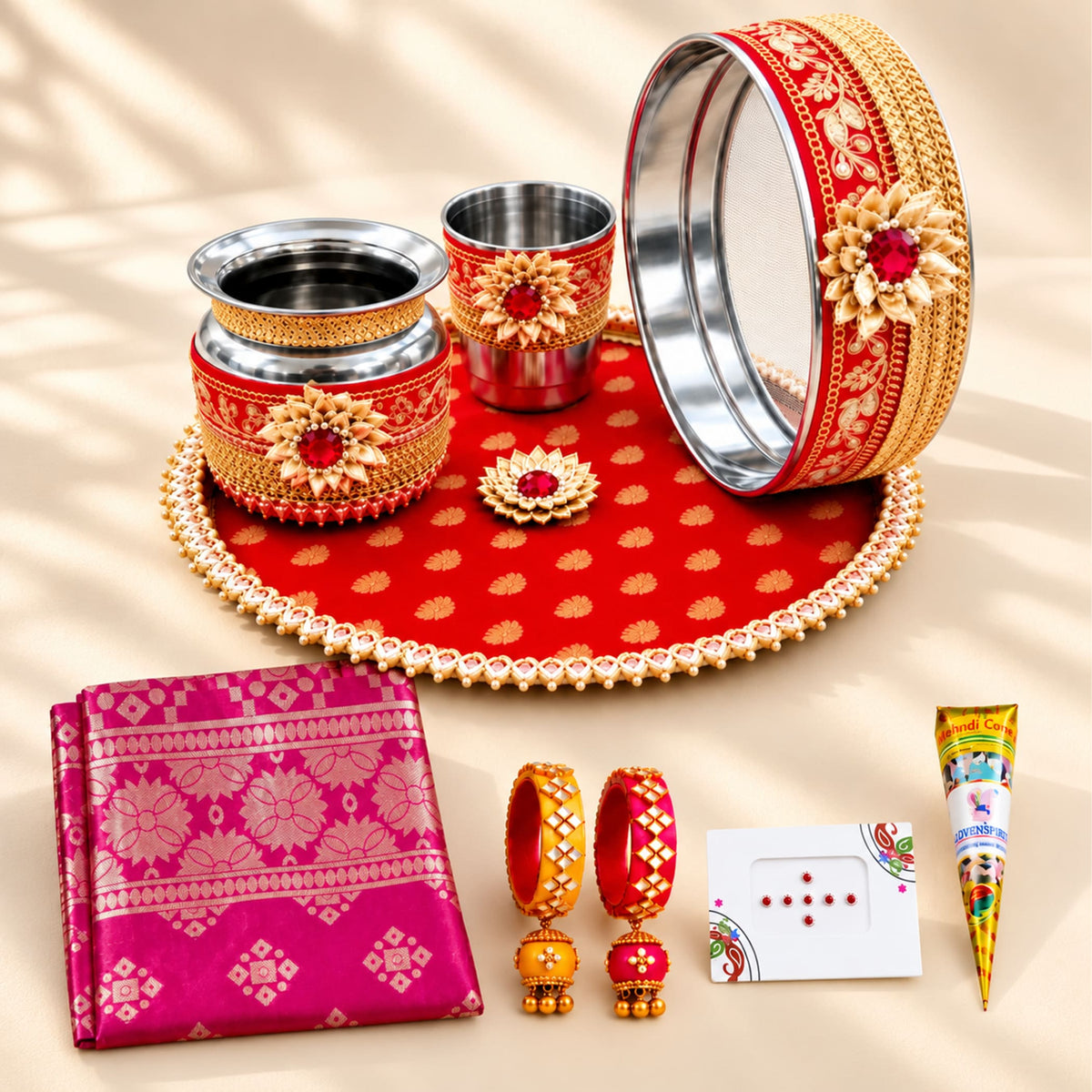 Red and gold karwa chauth pooja thali set with floral patterns and metallic accents for traditional indian festive use