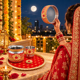 Red and gold ornate ceremonial sieve with intricate floral embroidery in karwa chauth pooja thali set for women