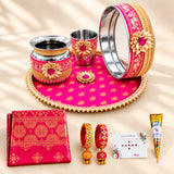 Pink and gold karwa chauth pooja thali set with intricate floral patterns and beaded edges for festive gifting