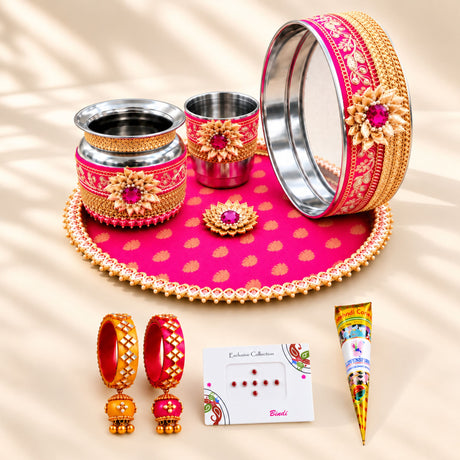 Pink and gold decorative bangle with intricate floral embroidery and central ruby gemstone for karwa chauth pooja thali set