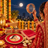 A decorative red and gold circular mirror with intricate beadwork and dangling pearls in karwa chauth pooja thali set