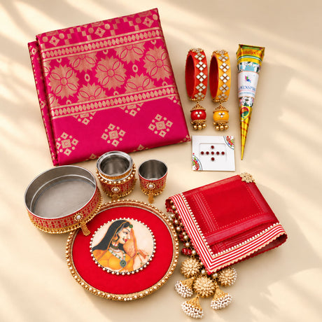 Red and gold embroidered silk dupatta with intricate floral patterns in karwa chauth pooja thali set for women