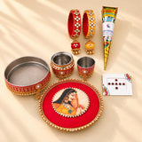 Red and gold beaded karwa chauth pooja thali with ornate woman illustration for traditional festive gifting set