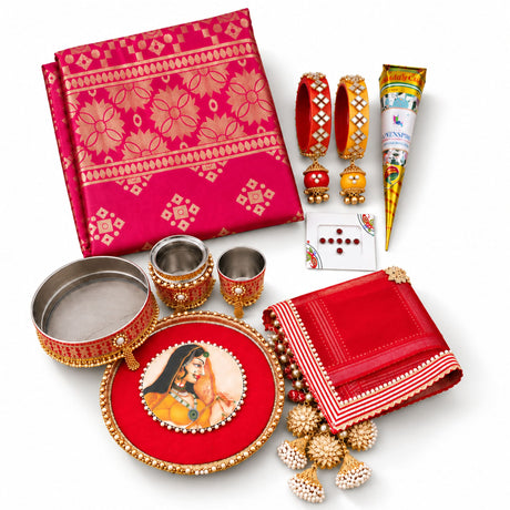 Vibrant pink and gold patterned silk fabric with intricate floral motifs in karwa chauth pooja thali set for women