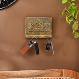 Gold ornate Indian doli key holder with embossed figures, 4 wall hooks